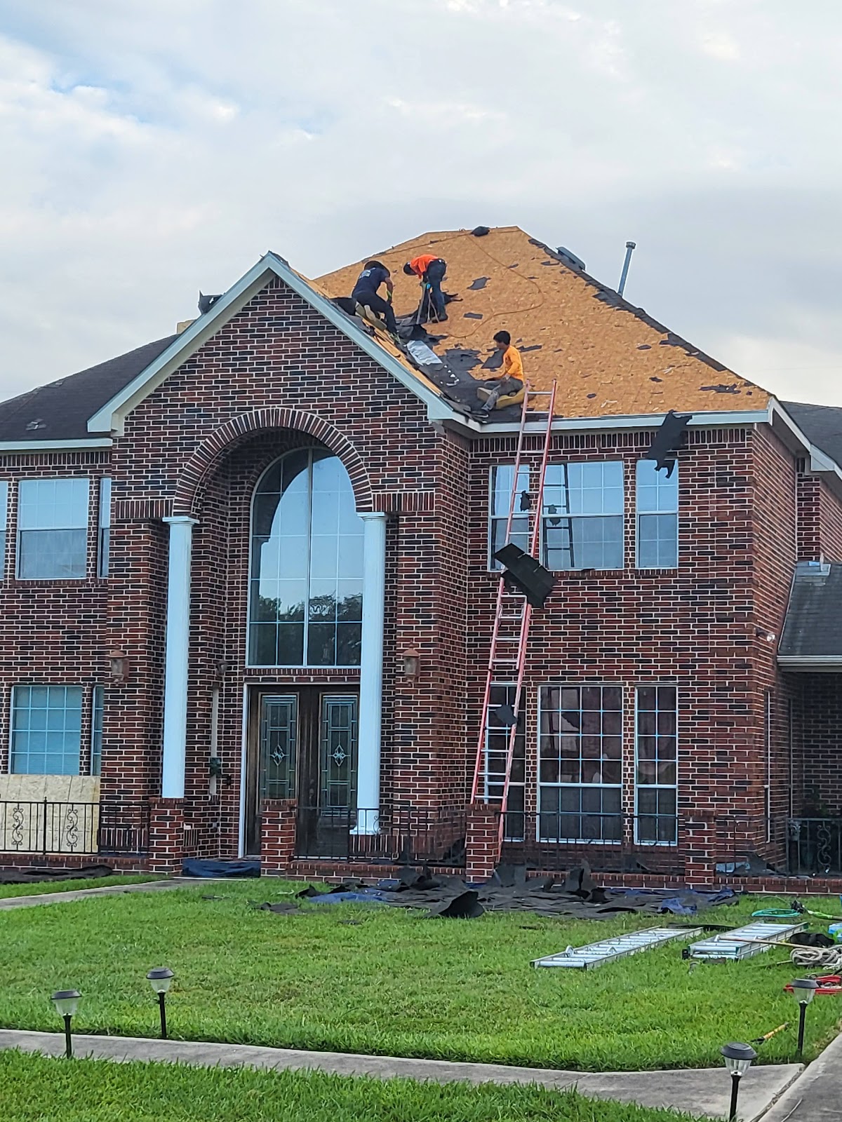 Roof tear-off on two-story home